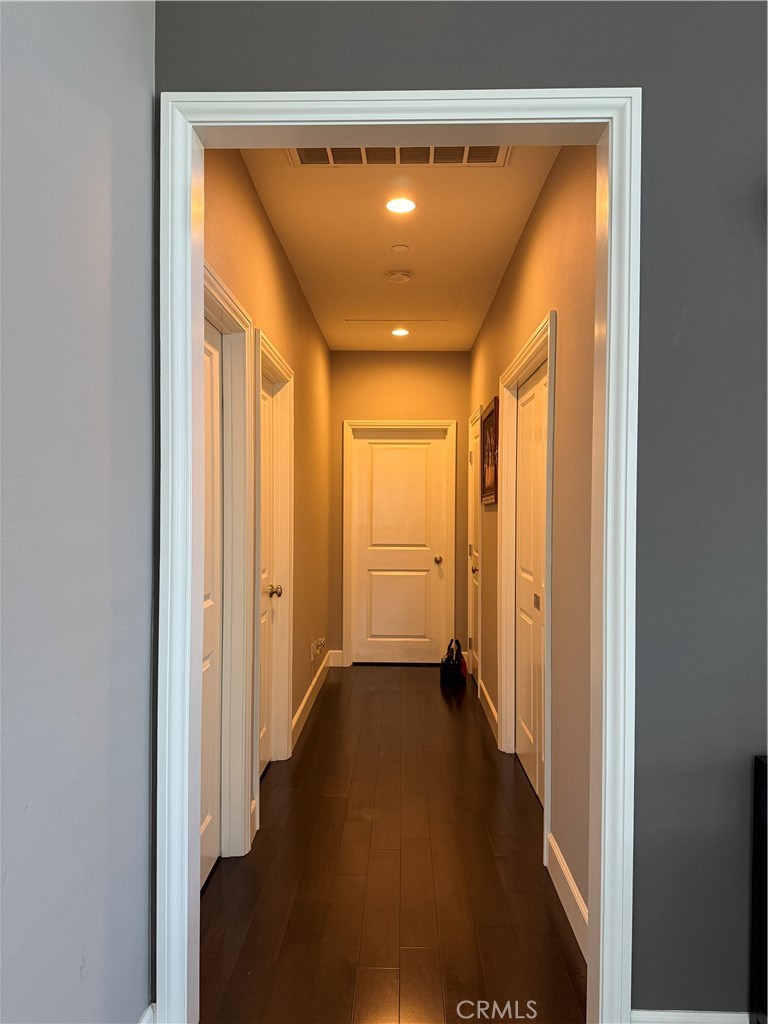 134 Rodeo Irvine, CA 92602 - Photo 10 of 23 a view of a hallway with wooden floor