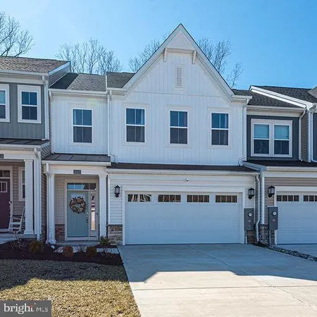 a front view of a house with yard