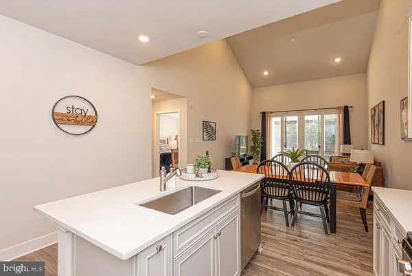 a view of a kitchen with a sink and dishwasher