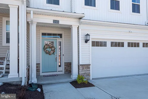 a front view of a house with a garage