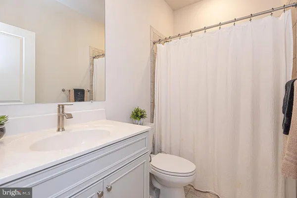 a bathroom with a shower and a toilet