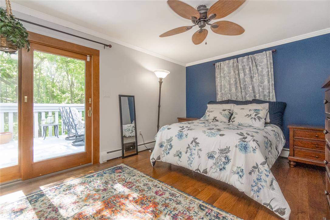 1325 Granger Road Northampton, PA 18067 - Photo 23 of 61 Hardwood floors and a glass door leading to a deck elevate this cozy bedroom retreat.