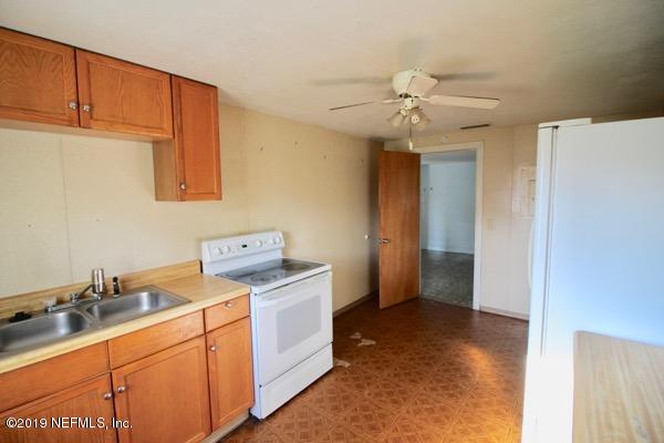 5905 Ricker Road Jacksonville, FL 32244 - Photo 12 of 24 a room with storage and utility