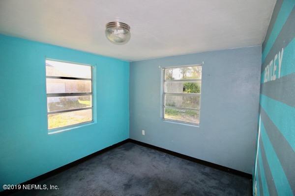 5905 Ricker Road Jacksonville, FL 32244 - Photo 18 of 24 a view of an empty room with a window