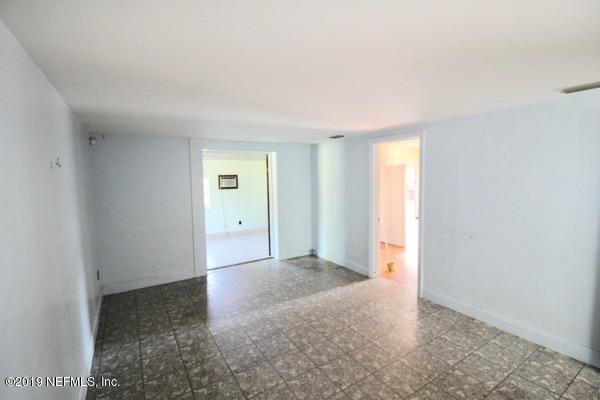 5905 Ricker Road Jacksonville, FL 32244 - Photo 3 of 24 a view of an empty room and window