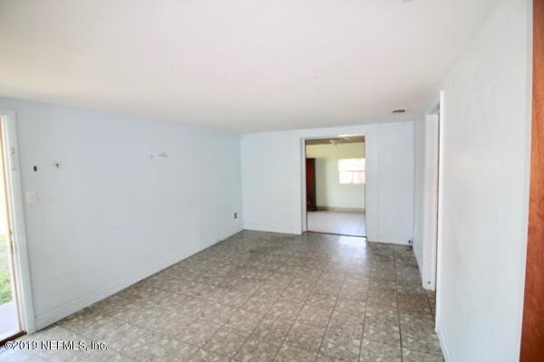 5905 Ricker Road Jacksonville, FL 32244 - Photo 4 of 24 a view of empty room with window