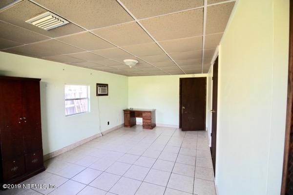 5905 Ricker Road Jacksonville, FL 32244 - Photo 7 of 24 a view of an empty room with a window