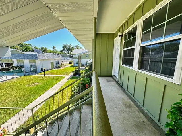 a view of swimming pool with seating area
