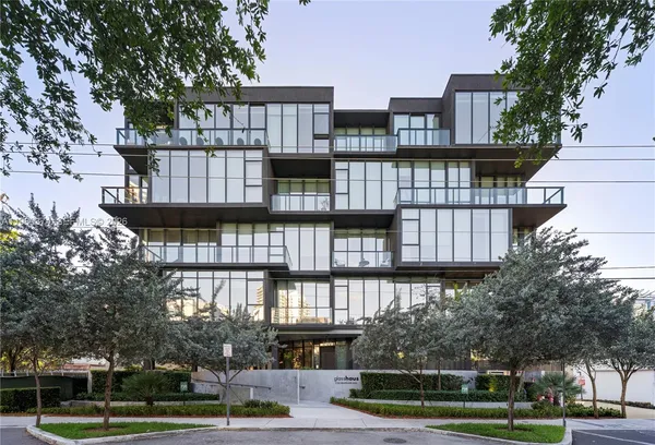 a view of a building and a tree