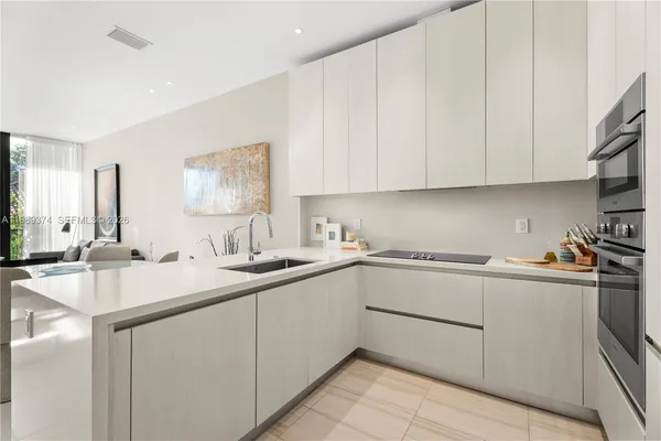 a kitchen with a sink and cabinets