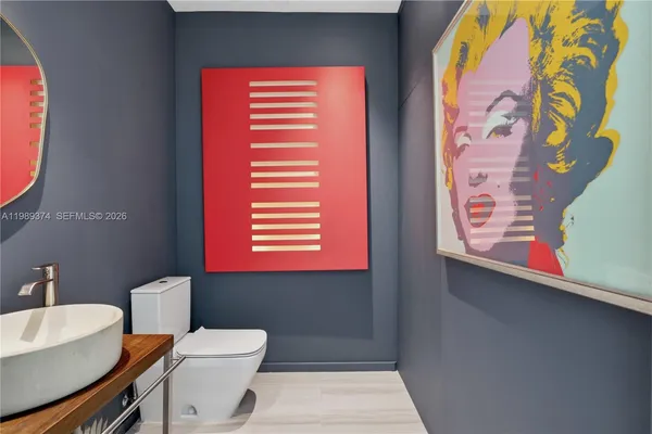 a bathroom with a toilet and a sink