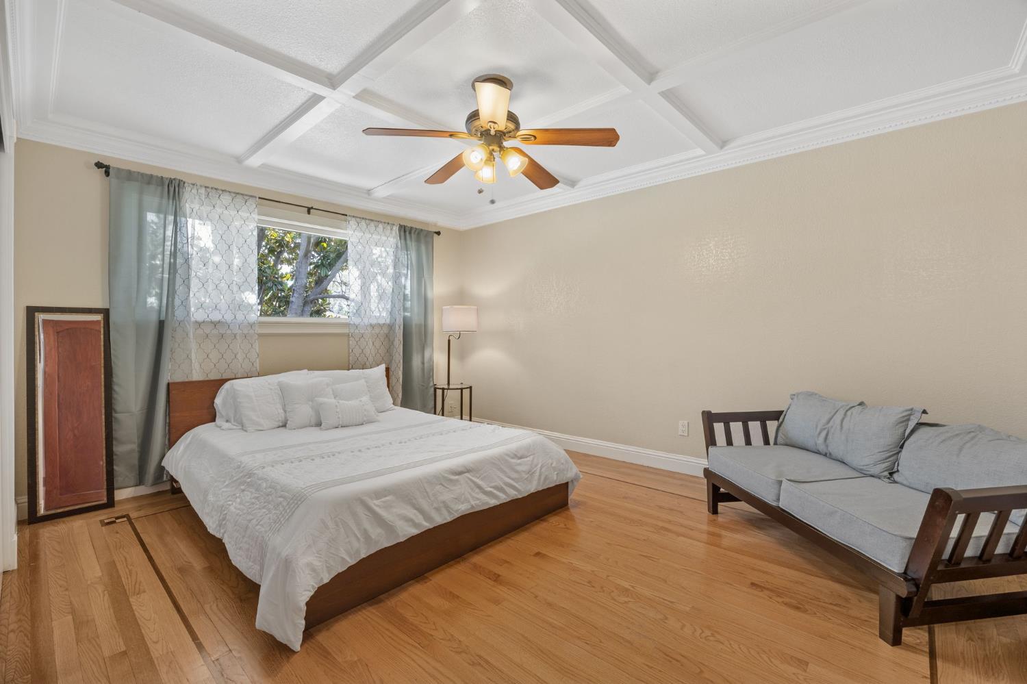 4206 Zephyr Way Sacramento, CA 95821 - Photo 31 of 45 a bedroom with a bed and a chandelier