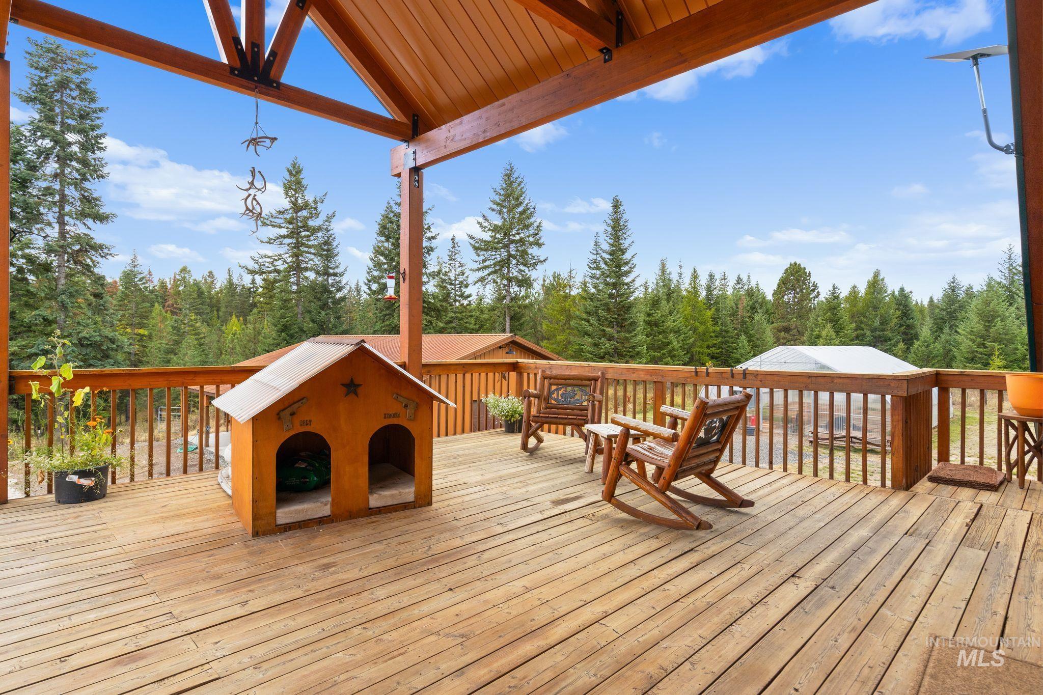 3989 East Mountain Road Anatone, WA 99401 - Photo 22 of 49 Expansive covered wood deck with structural wood beams and a wood railing