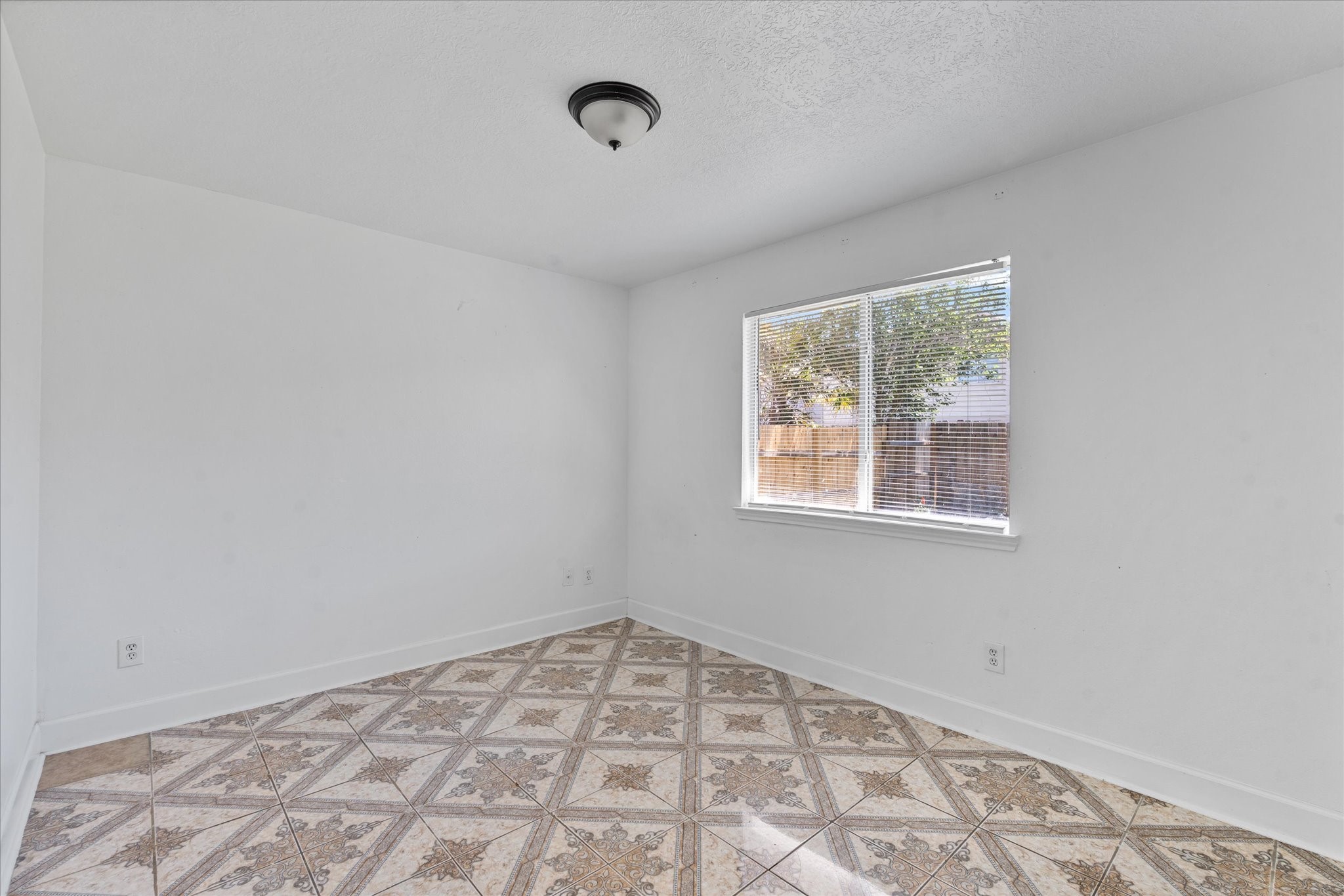 1410 Hade Falls Lane Houston, TX 77073 - Photo 17 of 25 a view of an empty room with a window