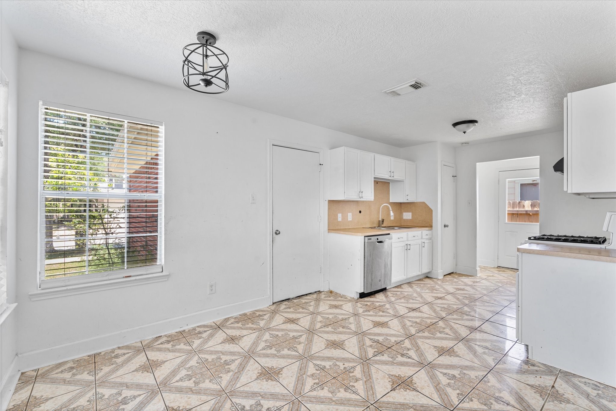1410 Hade Falls Lane Houston, TX 77073 - Photo 8 of 25 a bedroom with a bed and a stove top oven