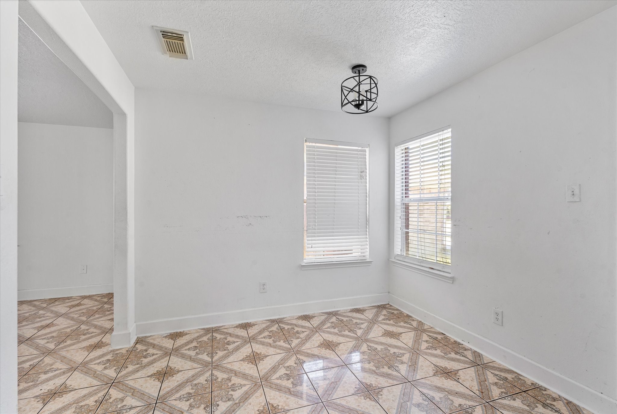 1410 Hade Falls Lane Houston, TX 77073 - Photo 9 of 25 an empty room with windows