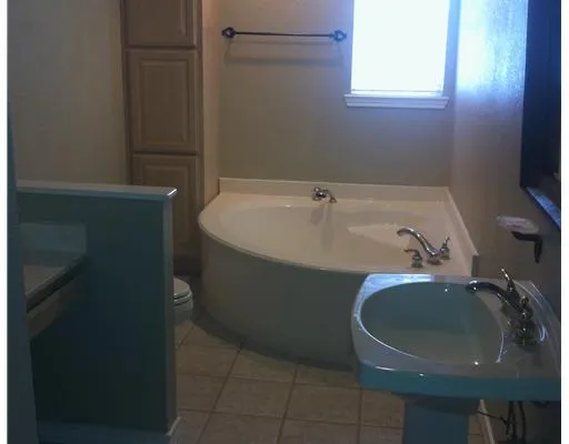 a bathroom with a sink and a tub