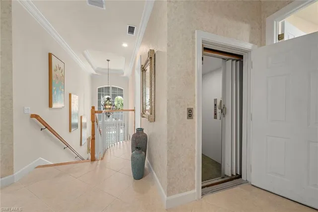 a view of a hallway with a view of living room