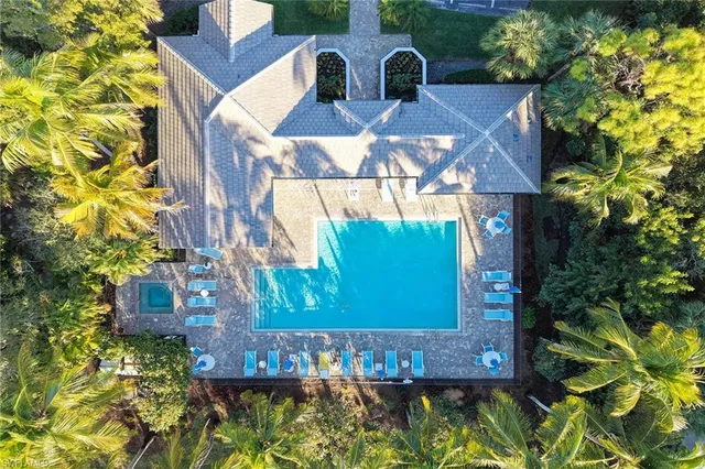 a view of a brick house with a yard