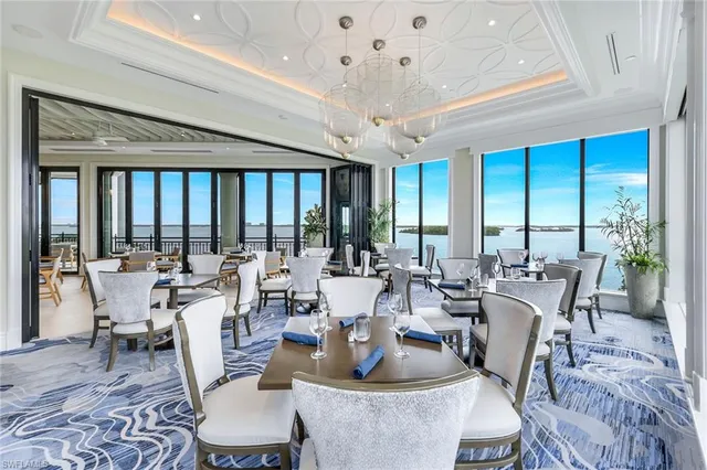 a very nice looking living room with furniture and a large window