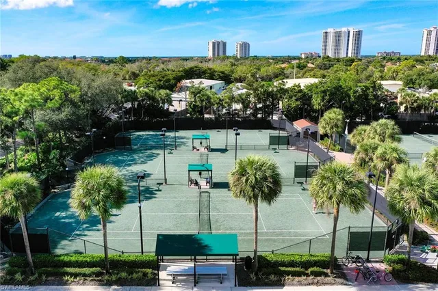a view of a garden with an buildings and street view
