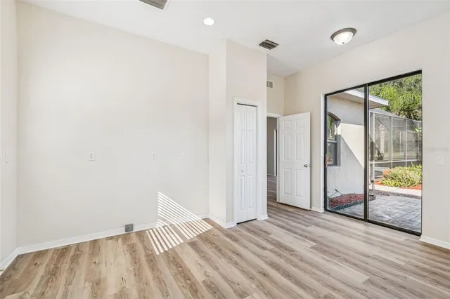 a view of an empty room with a window