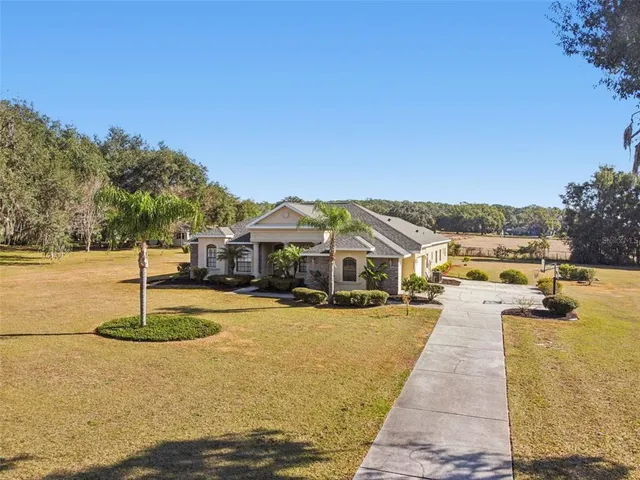 a view of a backyard with sitting area