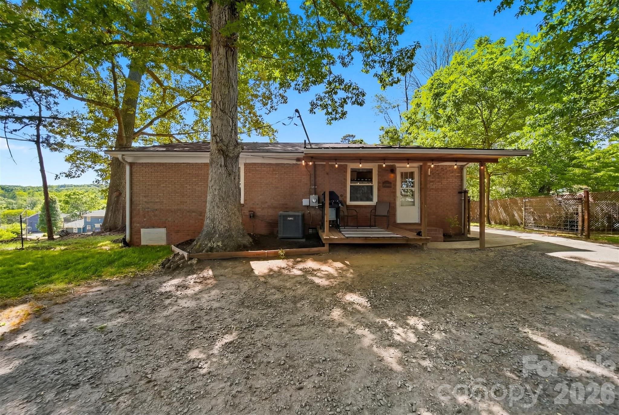 1312 County Home Road Conover, NC 28613 - Photo 20 of 25 a view of a house with a yard