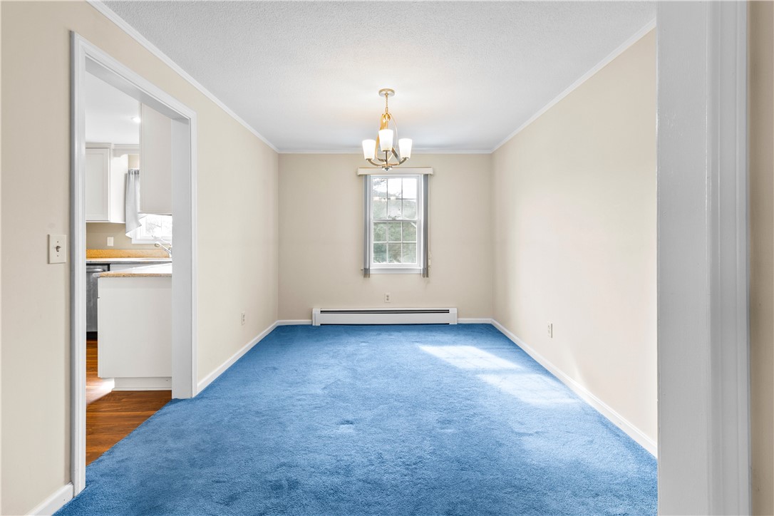 12 Beth Road Tiverton, RI 02878 - Photo 16 of 42 Spacious Dining Room - Hardwood Flooring Under the Carpet