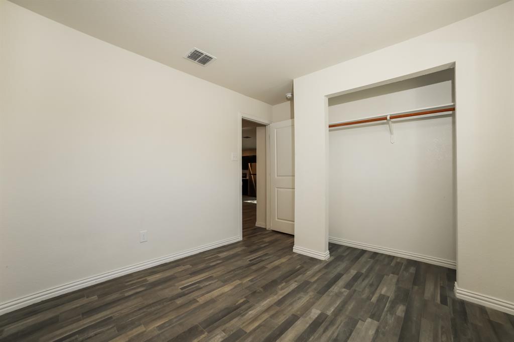 903 Olive Street Waco, TX 76704 - Photo 14 of 21 a view of an empty room with wooden floor