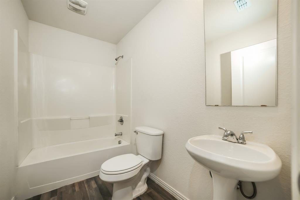 903 Olive Street Waco, TX 76704 - Photo 17 of 21 a bathroom with a sink toilet and shower