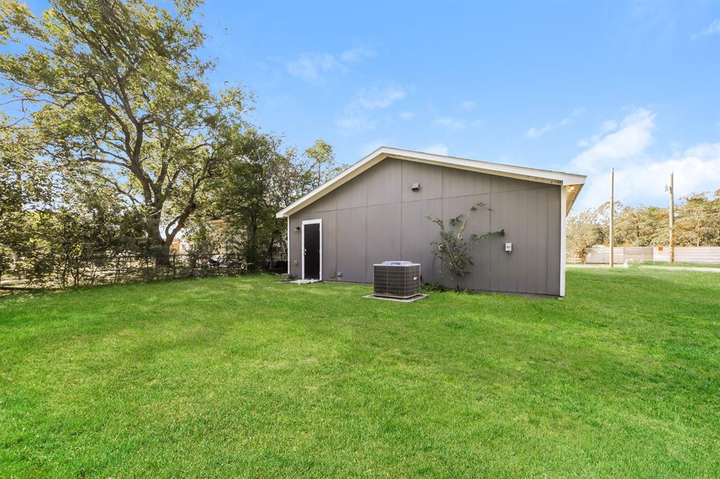 903 Olive Street Waco, TX 76704 - Photo 19 of 21 a view of a house with backyard and garden