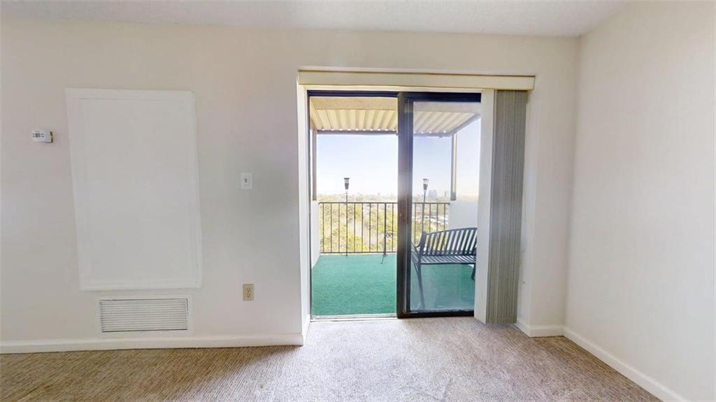 300 Johnson Ferry Road, Unit A1013 Atlanta, GA 30328 - Photo 13 of 18 a view of an empty room with glass door