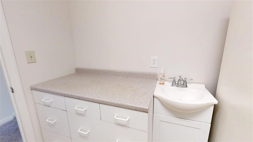 300 Johnson Ferry Road, Unit A1013 Atlanta, GA 30328 - Photo 17 of 18 a bathroom with a sink and a vanity