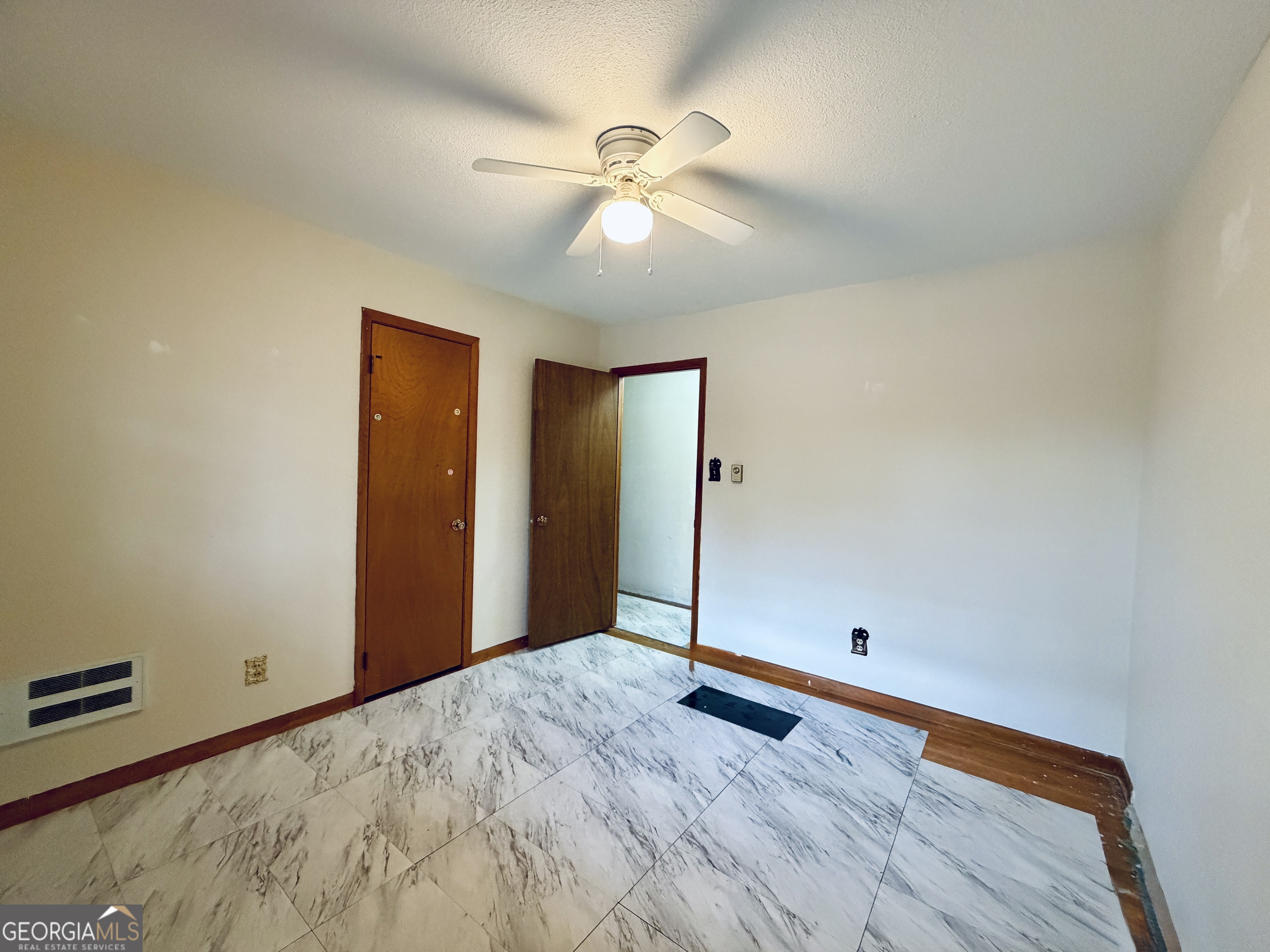 43 Sycamore Drive Toccoa, GA 30577 - Photo 11 of 22 wooden floor in an empty room with a window
