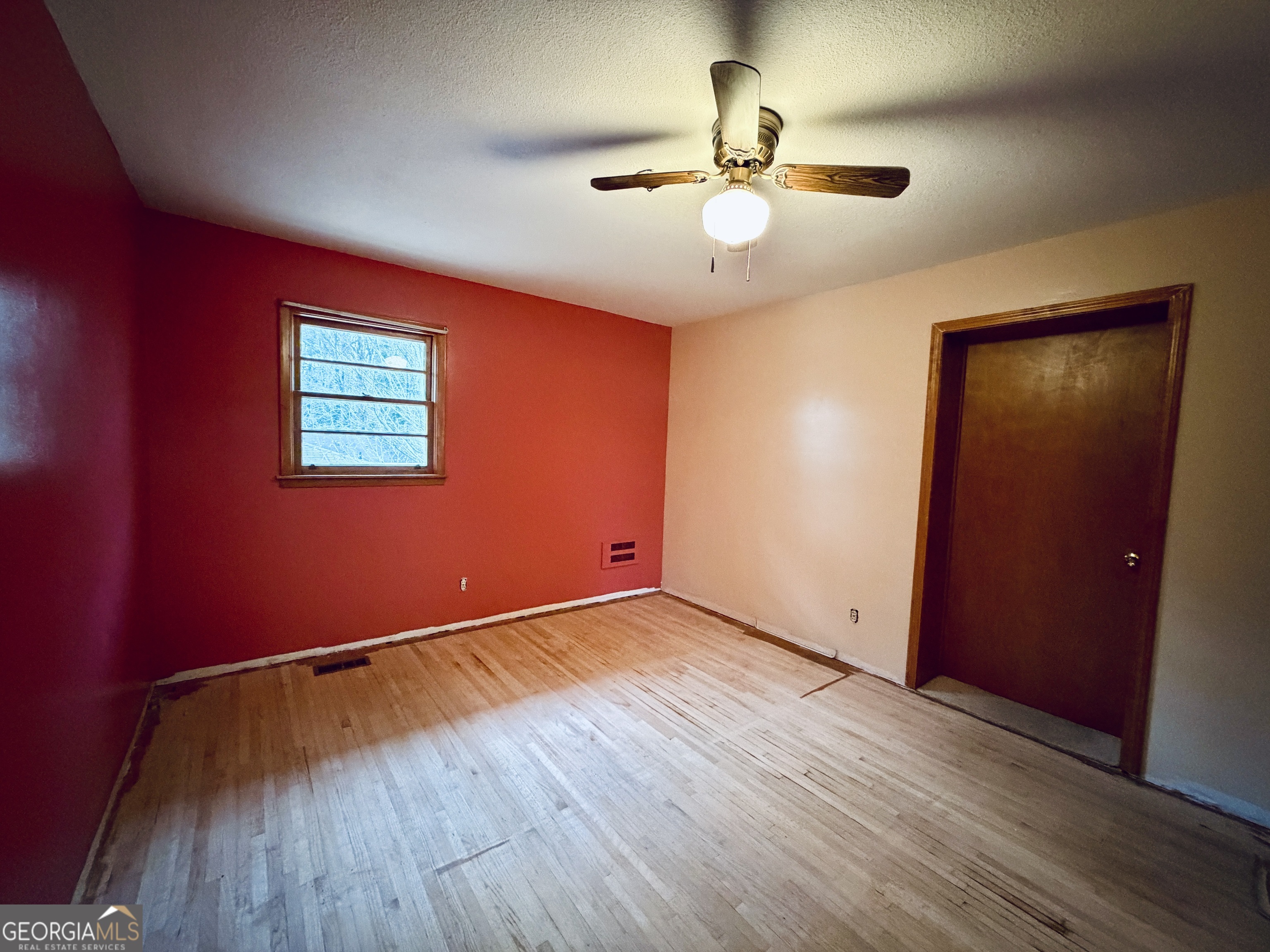 43 Sycamore Drive Toccoa, GA 30577 - Photo 12 of 22 an empty room with wooden floor and chandelier fan