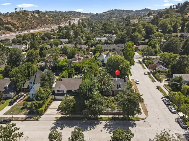 a kitchen with a sink window and cabinets