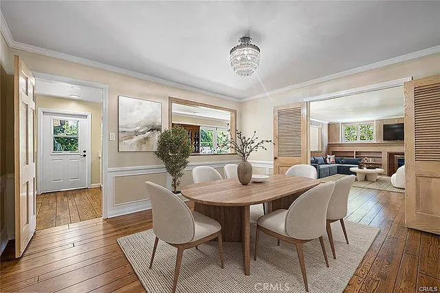 a bathroom with a sink mirror and toilet