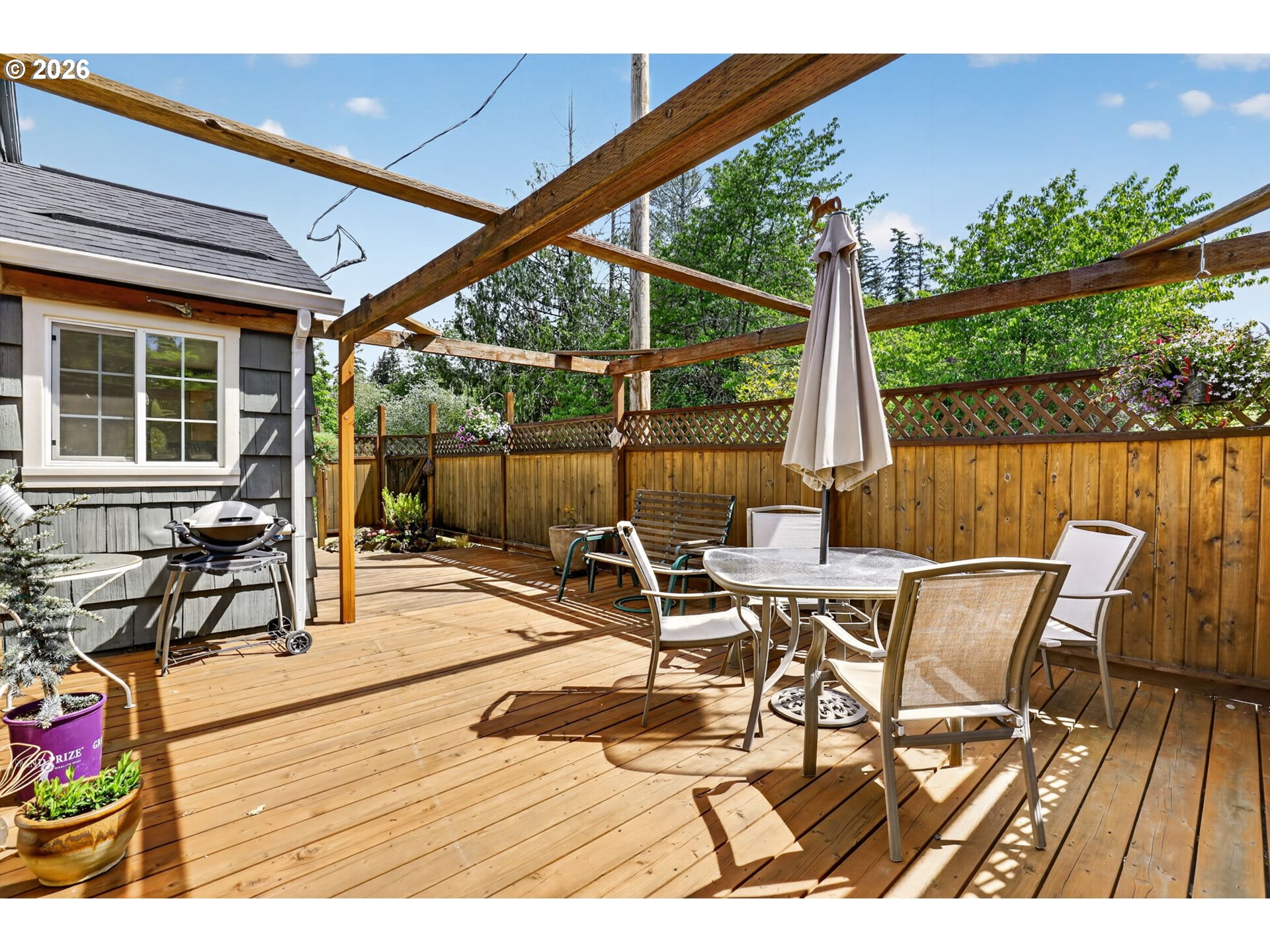 33951 Southeast Coupland Road Estacada, OR 97023 - Photo 32 of 48 a view of a patio with table and chairs and wooden floor