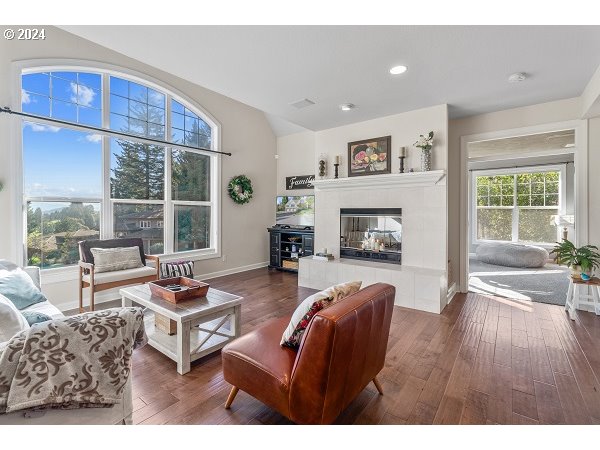 264 Southeast 41st Court Gresham, OR 97080 - Photo 13 of 37 a living room with furniture a fireplace and a table