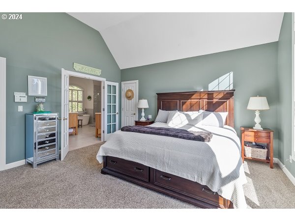 264 Southeast 41st Court Gresham, OR 97080 - Photo 24 of 37 a bedroom with a bed and walk in closet
