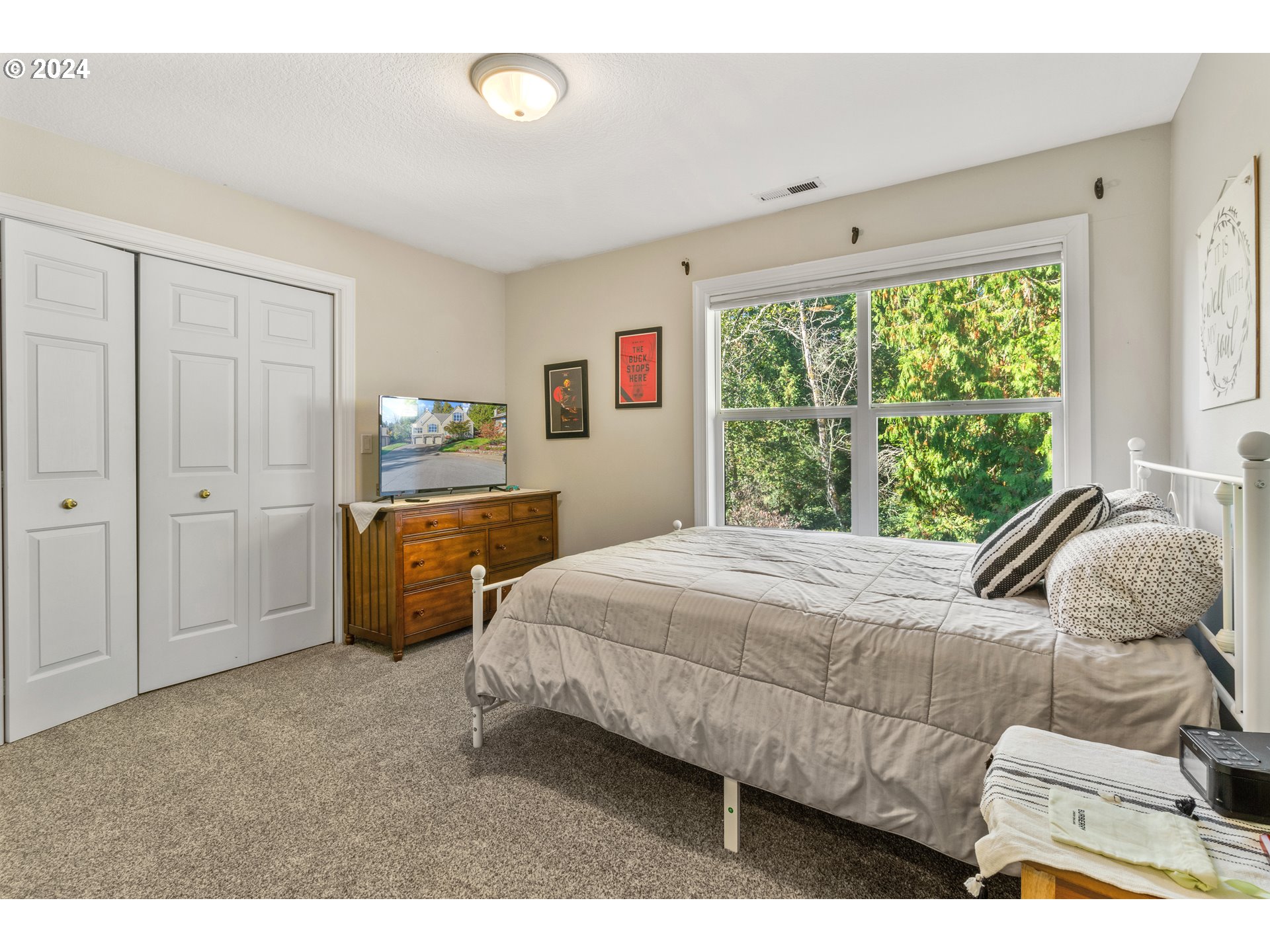 264 Southeast 41st Court Gresham, OR 97080 - Photo 30 of 37 a bedroom with a bed and a large window