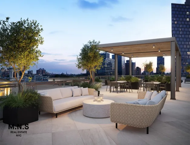 a living room with patio furniture and a potted plants