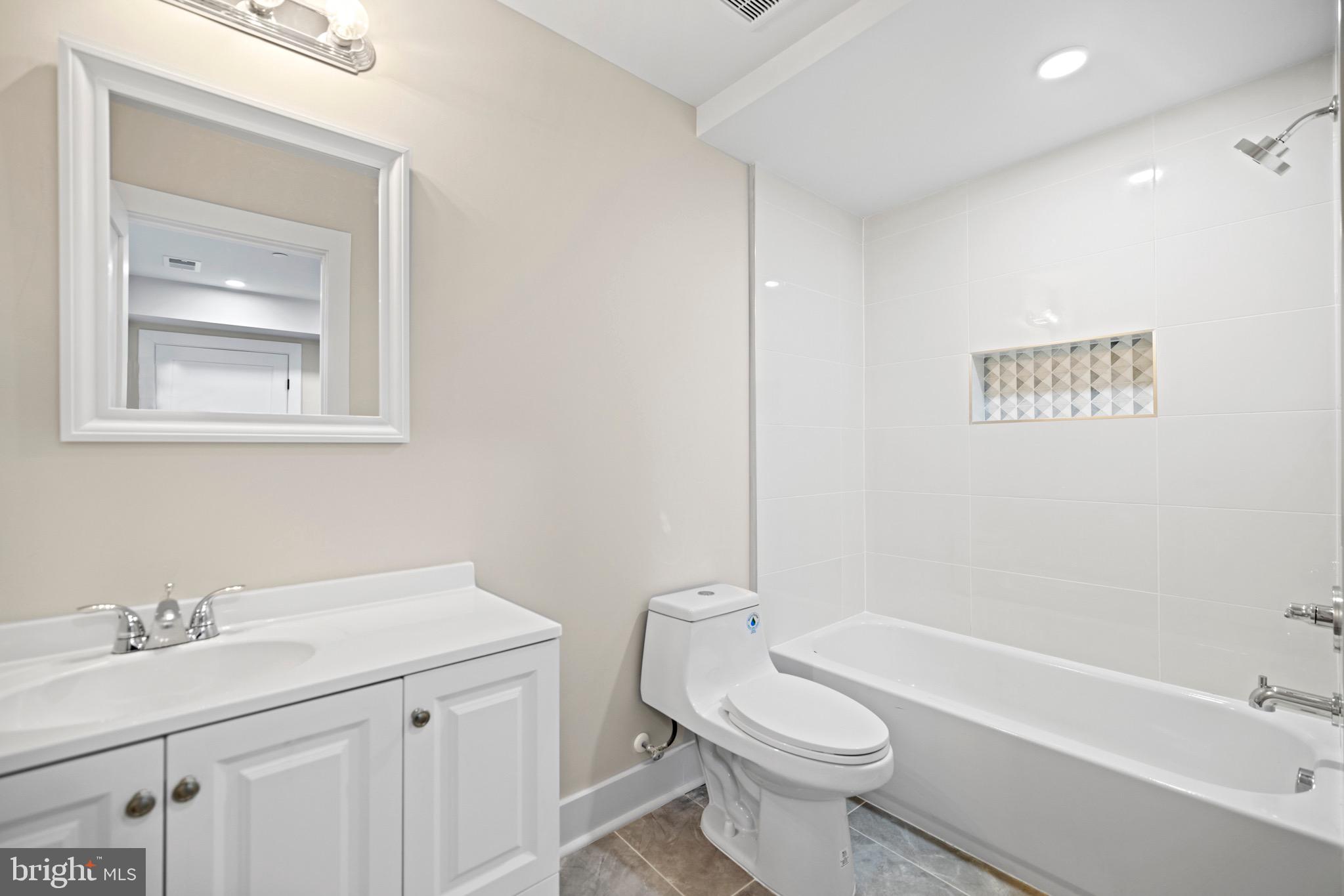 824 18th Street Northeast, Unit 1 Washington, DC 20002 - Photo 14 of 21 a bathroom with a sink a toilet and a bathtub