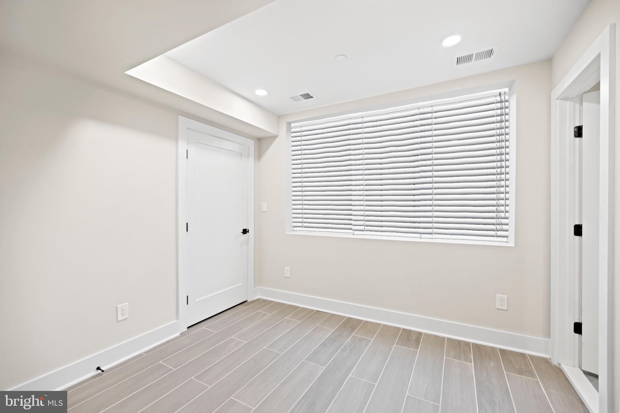 824 18th Street Northeast, Unit 1 Washington, DC 20002 - Photo 15 of 21 wooden floor in an empty room