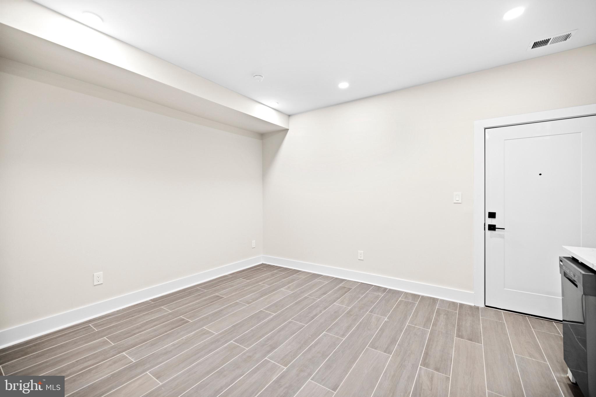 824 18th Street Northeast, Unit 1 Washington, DC 20002 - Photo 17 of 21 a view of an empty room with wooden floor