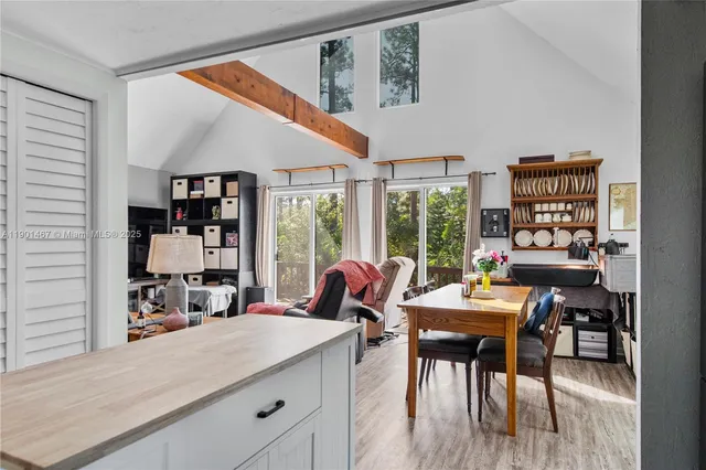 a view of a dining room with furniture window and outside view