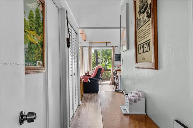 a view of living room filled with furniture and a window