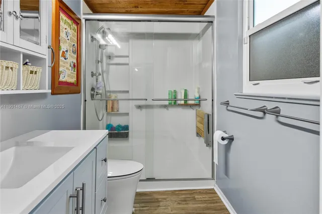 a bathroom with a sink and toilet