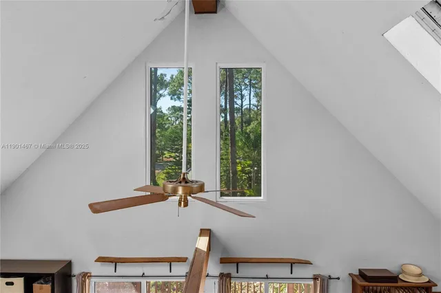 a view of a livingroom with furniture and window